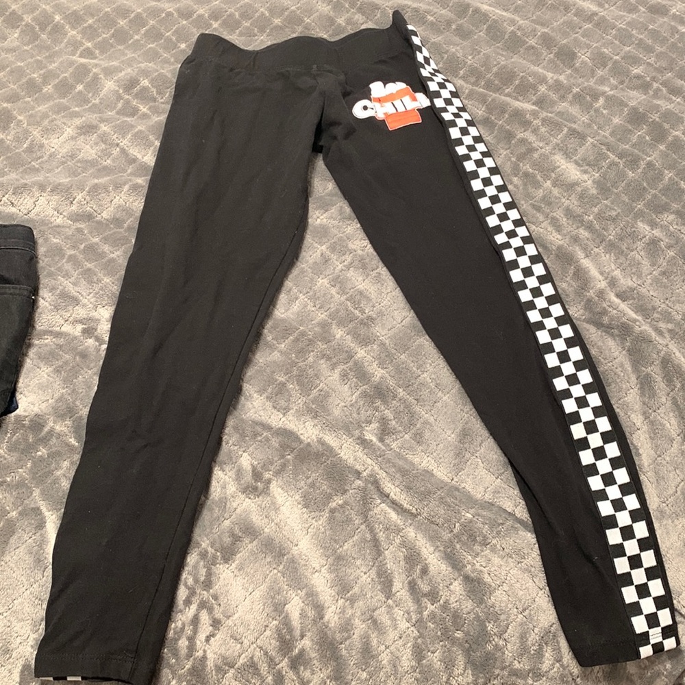Snoopy black leggings for girls size small.